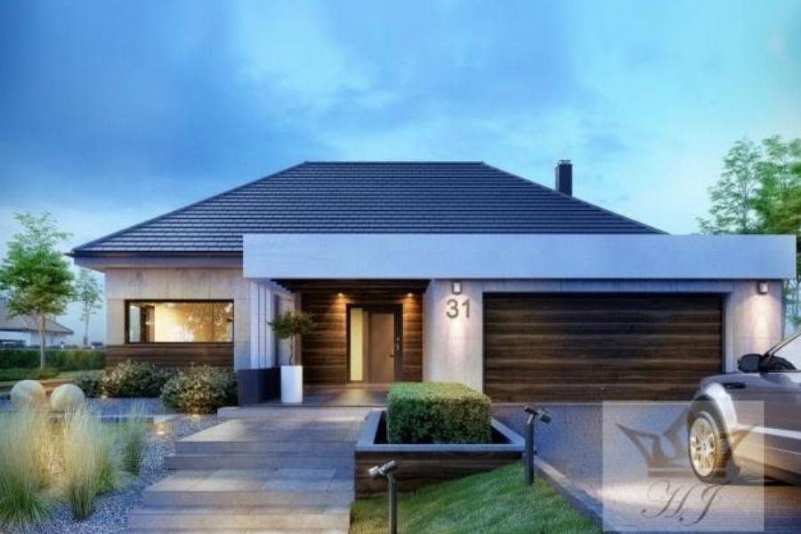 Haus Davos - Hauseingang mit Garage rechts abends_Visualisierung